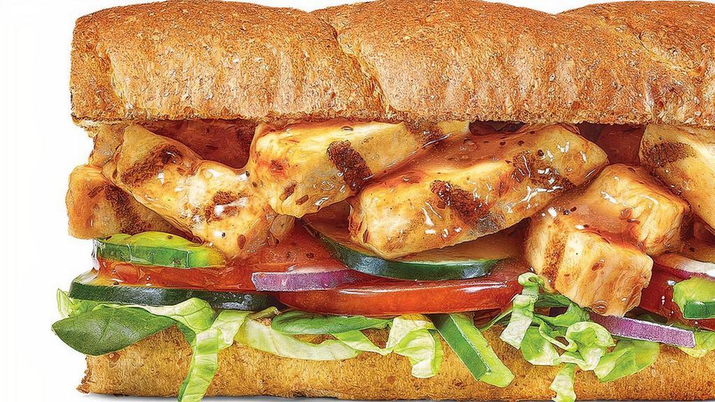 Sweet Onion Chicken Teriyaki · The Sweet Onion Chicken Teriyaki sub is one sah-weeet sub. It starts with Hearty Multigrain bread, add perfectly cooked grilled chicken strips, marinated in our NEW Sweet Onion Teriyaki Sauce, then pile on the crunch with lettuce, spinach, tomatoes, cucumbers, green peppers, red onions and top with another pass of our NEW Sweet Onion Teriyaki sauce.