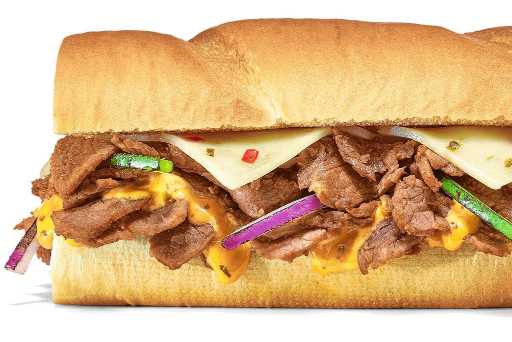 Baja Steak & Jack · Spicy, cheesy, smoky — this one’s got it all. Steak meets Pepper Jack Cheese, with green peppers, red onions, and Baja Chipotle Sauce on Artisan Italian Bread. Try not to fall head over heels.
