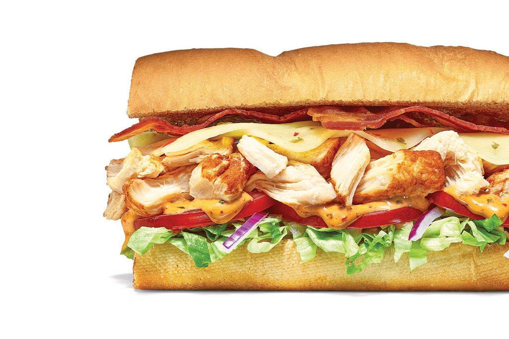 Baja Chicken & Bacon · An irresistible sub with Southwest attitude: hand-pulled, Rotisserie-Style Chicken, Pepper Jack Cheese, and Hickory-Smoked Bacon, topped with our smoky Baja Chipotle sauce.