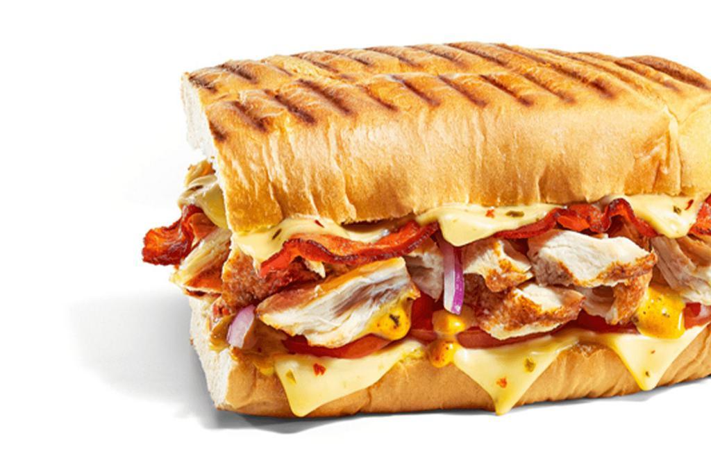 Baja Chicken & Bacon Melt · Freshly made? Cheesy? Why not have both? Rotisserie-Style Chicken, Hickory-Smoked Bacon, and our Baja Chipotle sauce are topped with crisp, veggies and extra Pepper Jack Cheese.