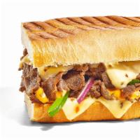 Baja Steak & Jack Melt · Steak is smothered with gooey, melty Pepper Jack Cheese. Add in green peppers and red onions...