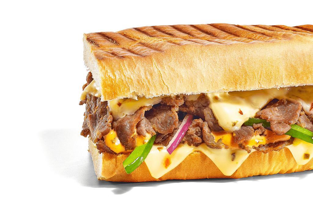Baja Steak & Jack Melt · Steak is smothered with gooey, melty Pepper Jack Cheese. Add in green peppers and red onions, and top it with Baja Chipotle Sauce, and you’ve got a cheesy, smoky, perfect meal.