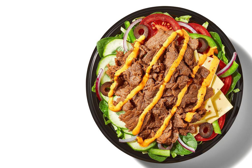 Baja Steak & Jack (500 Cals) · That Baja Steak & Jack Footlong you fell in love with? It comes in a bowl too: Steak and Pepper Jack Cheese, piled high on fresh, crisp veggies, with our Baja Chipotle Sauce.