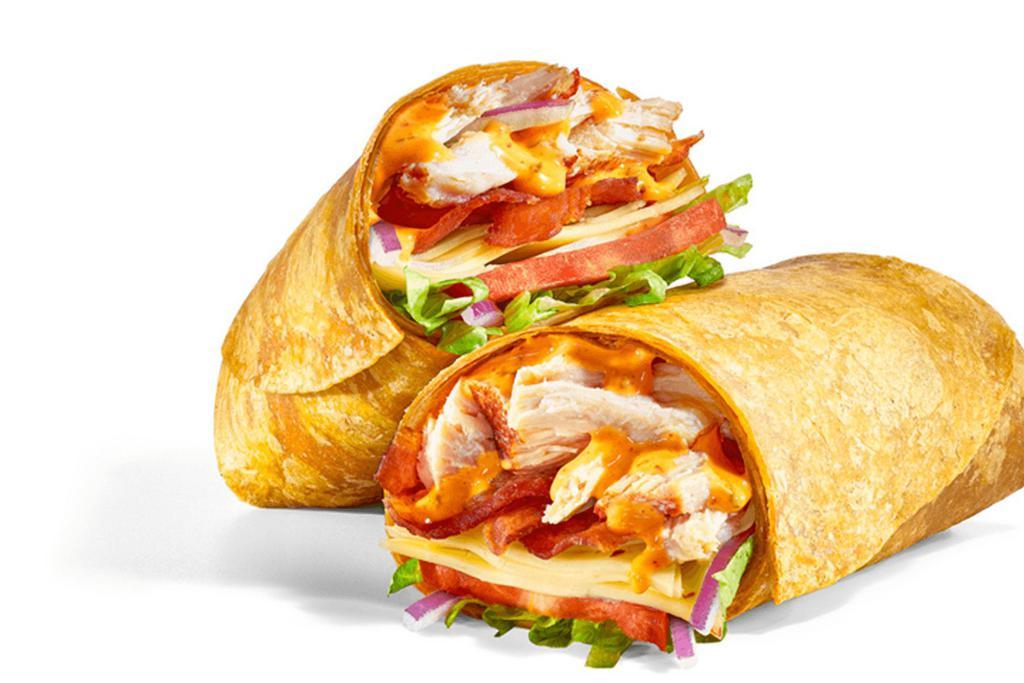 Baja Chicken & Bacon (820 Cals) · Our spicy, smoky Baja Chicken & Bacon — in a wrap! Rotisserie-Style Chicken, Pepper Jack Cheese, Hickory-Smoked Bacon, veggies, and Baja Chipotle sauce folded in a Tomato Basil Wrap.