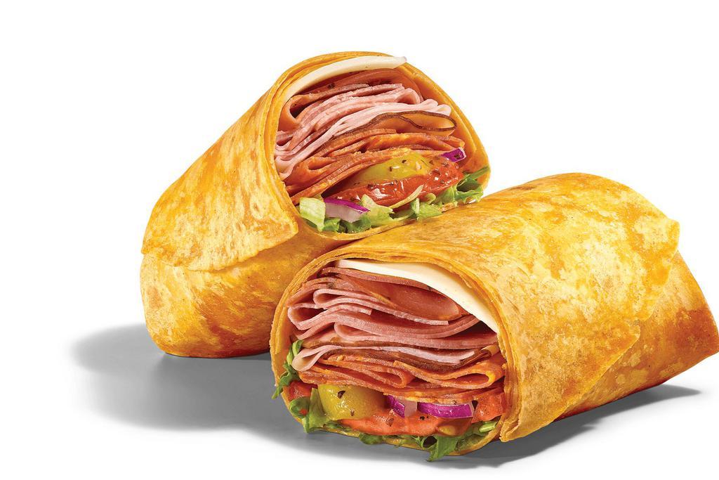 Supreme Meats (930 Cals) · The flavors of Italy all wrapped up into one delicious, heavenly wrap. We roll up NEW Italian-style capicola , pile on thin-sliced Black Forest Ham, Genoa Salami , and pepperoni  in a Tomato Basil wrap with provolone, lettuce, tomatoes, red onions, and tangy banana peppers and finally top it with our famous MVP Parmesan Vinaigrette™.