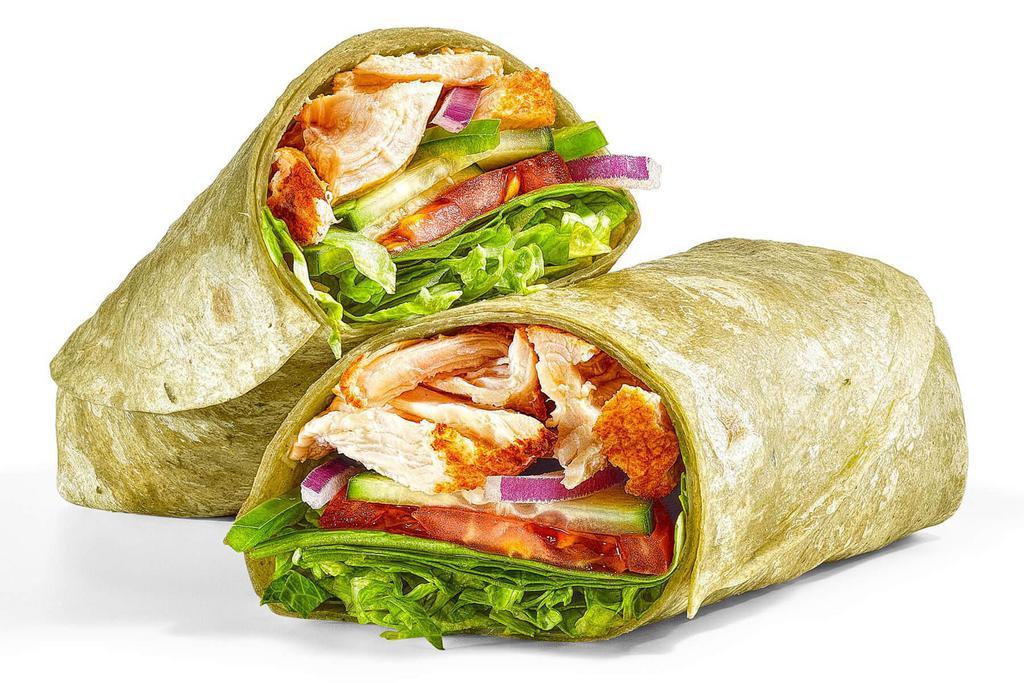 Rotisserie-Style Chicken (500 Cals) · A generous portion of juicy rotisserie-style chicken with fresh lettuce, baby spinach, tomatoes, cucumbers, green peppers and red onions. Served in a spinach wrap.