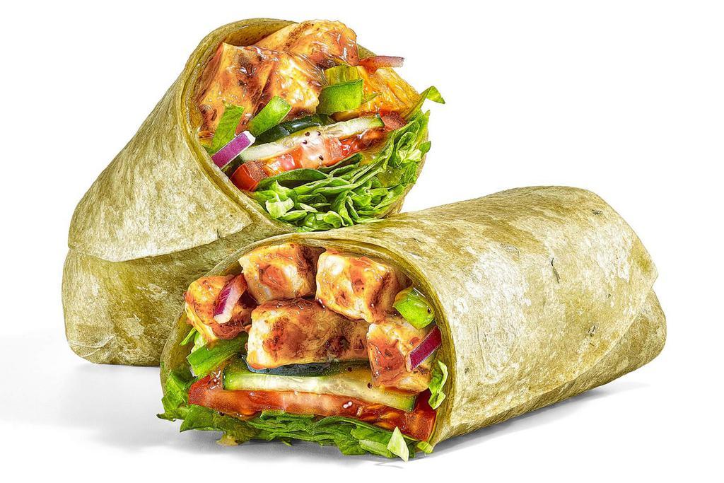 Sweet Onion Chicken Teriyaki (590 Cals) · Packed with flavor and texture, the sweet and tangy Sweet Onion Chicken Teriyaki wrap cannot be kept under wraps. Dig into a classic combination of juicy chicken strips marinated in our NEW Sweet Onion Teriyaki sauce, with lettuce, spinach, tomatoes, cucumbers, green peppers and red onions topped with more of our NEW Sweet Onion Teriyaki Sauce and piled into our tasty wrap. One bite and you’ll want to tell the world about it.