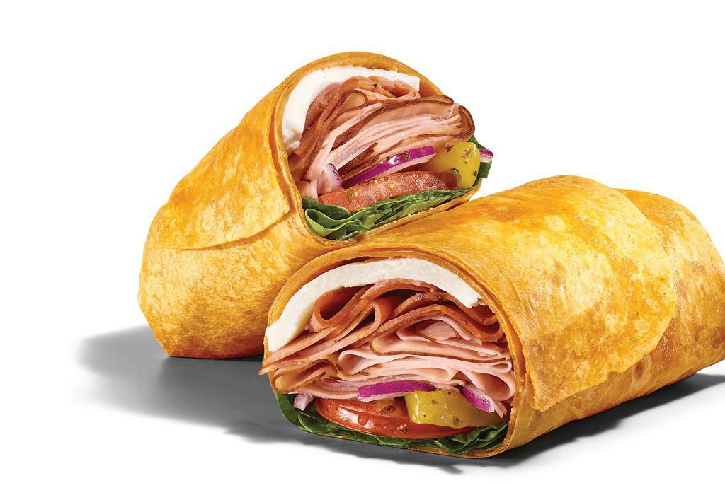 Mozza Meat  (650 Cals) · Roll it up and take it down. The Mozza Meat wrap has thin-sliced Black Forest Ham, NEW Italian-style capicola and  Belgioioso® Fresh  Mozzarella rolled in a Tomato Basil wrap with spinach, tomatoes, red onions, and banana peppers and drizzled with our famous MVP Parmesan Vinaigrette™.