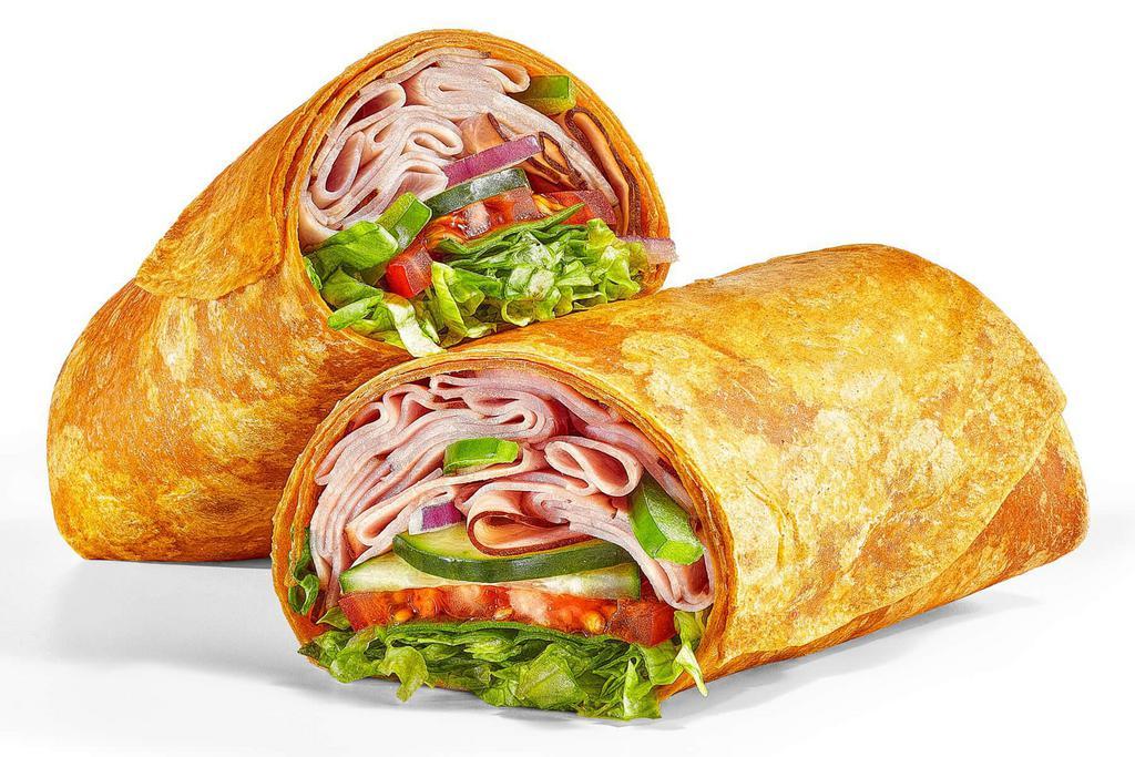 Black Forest Ham (440 Cals) · The Black Forest Ham Wrap is packed with a double portion of ham packed into a tomato basil wrap with lettuce, spinach, tomatoes, cucumbers, green peppers and red onions. Definitely delish.