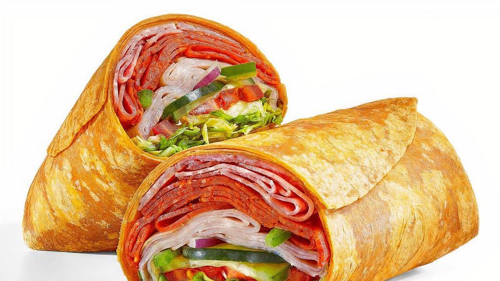 Italian B.M.T. ® (680 Cals) · The Italian B.M.T. ® wrap tastes great on a tomato basil wrap. It's filled with a double portion of Genoa salami, spicy pepperoni, and Black Forest ham topped with lettuce, tomatoes, cucumbers, green peppers, and red onions. So tasty.