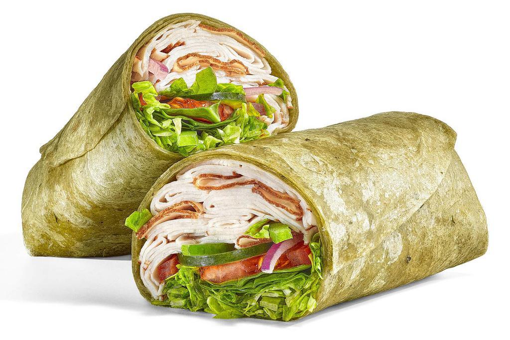 Oven Roasted Turkey (430 Cals) · Our Oven Roasted Turkey Wrap is a go-to. It's a footlong portion of our premium, thin-sliced, oven roasted turkey, with fresh veggies like lettuce, tomatoes, baby spinach, cucumbers, green peppers and red onions, all served up in a spinach wrap.
