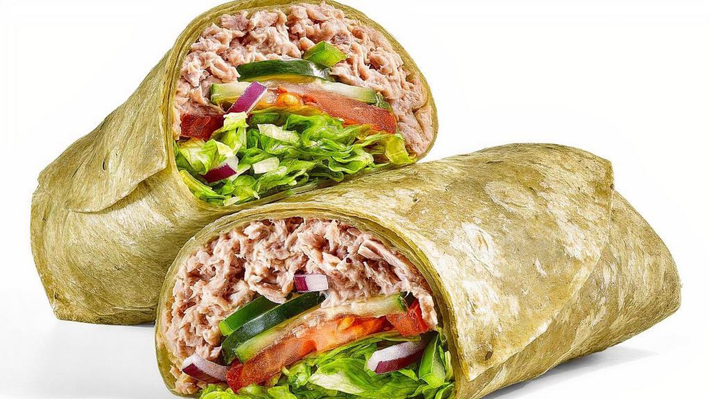 Tuna (820 Cals) · Our tasty Tuna Wrap is completely cravable. It has a double serving of 100% wild caught tuna mixed with mayo in a spinach wrap. Then it gets topped with any crunchy veggies you want.