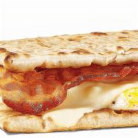 Bacon, Egg & Cheese · Start your day in a sizzlin' way with  bacon, egg, and melty cheese on freshly toasted flatb...