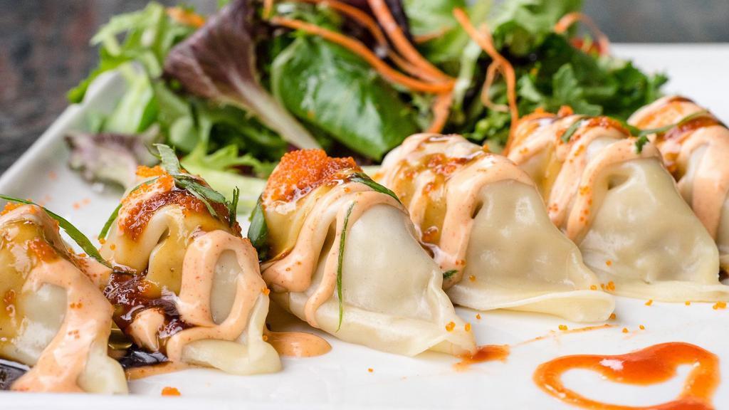 #6 Thai Spicy Pot Stickers · Crispy potstickers with thai spicy sauce and salad.