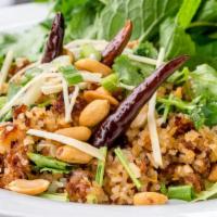 #12 Nam Kao (Crispy Rice Salad) · Crispy rice with ground pork, shredded coconut, cilantro, peanuts, green onion, mint, and cr...