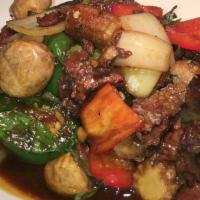 #18 Basil Beef · Sliced beef flank wok-tossed with chili, garlic, mushroom, onion, and basil.