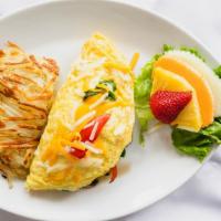 Veggie Omelette · Seasonal vegetables and hash or fruit and toast.