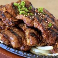 32. Gal Bi / 갈비 · Grilled marinated beef short ribs.