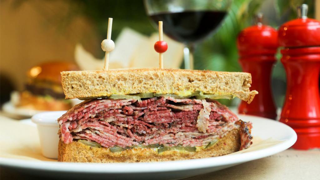 Ham, Pastrami & Cheese Sandwich · Sizzling ham slices, pastrami, cheese and choice of side.