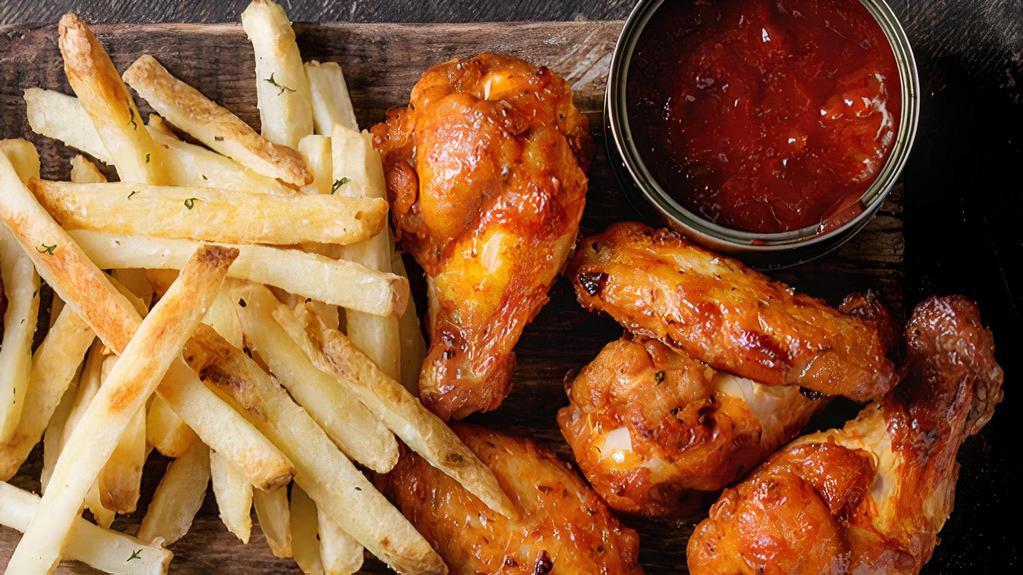 Spicy Chicken Wings with Fries · Spicy flavored chicken wings.