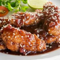 Sweet & Sour Chicken Wings with Fries · Sweet & Sour flavored chicken wings.