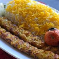 Chabli Kabab Meal (Rice & Salad) · Fresh off the grill Chabli (minced) skewers served on a bed of rice with a side salad.