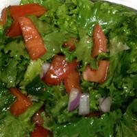 Salad · Hearts of green leaf lettuce, onions, tomatoes, and jalapeño mixed with corn oil and Ethiopi...