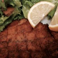 Fish Tibs · Thin slices of fillet tilapia lightly breaded and pan fried in corn oil, served with side sa...