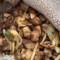 Doro Tibs · Boneless marinated chicken sautéed with onions, jalapeño, garlic, and rosemary.