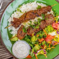 Lamb Shish Kebab · Grilled tender lamb chunks treated with house-made seasoning threaded on skewer. Served with...