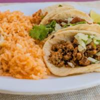 Taco Plate · Three tacos, choice of meat, rice and beans, cilantro, onions and taco sauce.