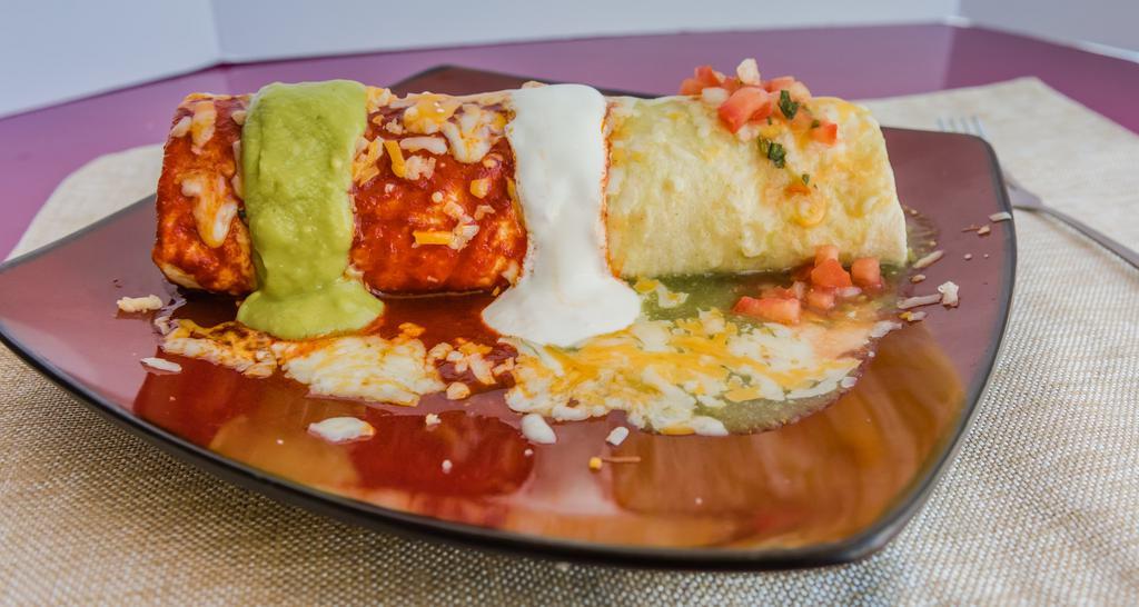 Wet Burrito · Rice, beans, onions, cilantro, topped with red or green sauce, cheese, sour cream, guacamole, hot salsa and choice of meat.