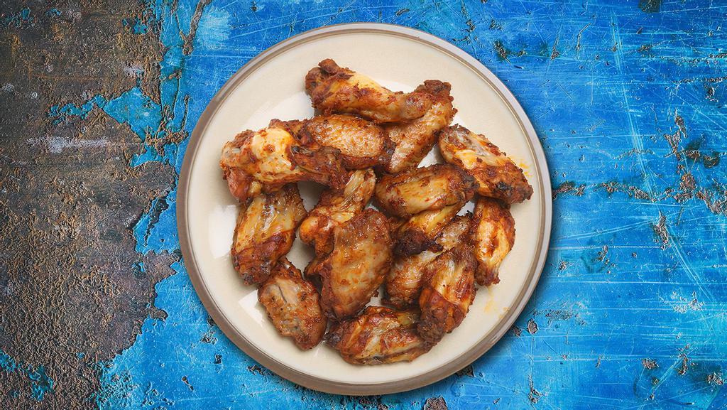 Chicken Wings (6 pcs) · Bone-in traditional chicken wings in a choice of buffalo, sweet chili garlic or our signature barbeque sauce