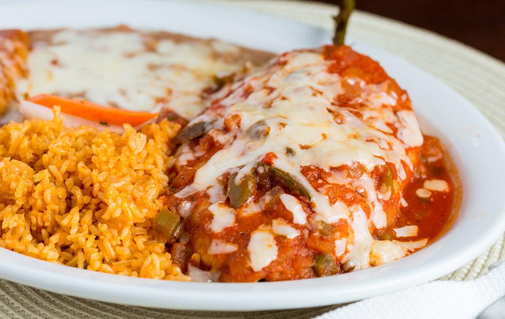 Chile Rellenos Dinner Entree · Served with rice and beans.  Stuffed with cheese, dipped in our homemade egg batter and lightly crisped. Topped with salsa ranchero and cheese.