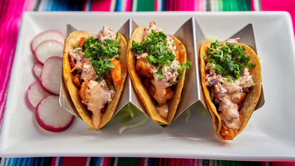 Piñata Shrimp Tacos · Three shrimp tacos topped with fresh sliced seasoned cabbage slaw and a delicious homemade chipotle sauce. Beans, rice, and salad are Not included.