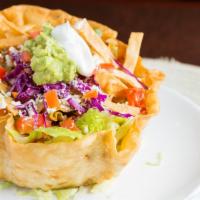 Taco Salad · Flour tortilla bowl filled with refried beans, lettuce & your choice of chicken, shredded be...