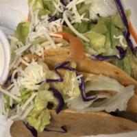 Fish Tacos · These two soft corn tortillas are filled with fish, sour cream, freshly made guacamole and s...