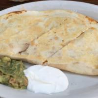 Quesadilla · A large flour tortilla filled with jack and cheddar cheese, your choice of chicken, chorizo ...