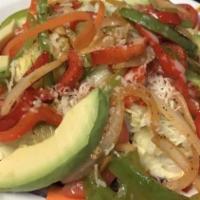Rancho Salad · This salad combines fresh lettuce mixed with tomatoes, grilled bell peppers and onions, topp...