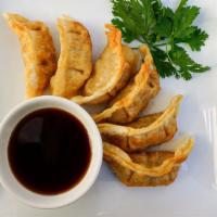 Pork Mandu · Fried pork dumplings with a house special dipping sauce.