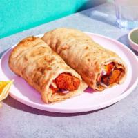 Chicken Tikka Masala Roll · With sliced onions and your choice of chutney in a roti roll.
