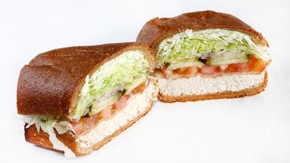 The Melt · Your choice of grilled chicken breast or tuna melted with your choice of cheese. All sandwiches come with lettuce, tomatoes, red onions, pickles, pepperoncini, salt & pepper, house vinaigrette, and your choice of mayo and mustard.