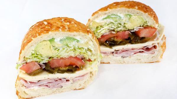 Alma's Hot & Spicy · Your choice of black forest ham or turkey with havarti, avocado, jalapenos, and ghost pepper hot sauce. All sandwiches come with lettuce, tomatoes, red onions, pickles, pepperoncini, salt & pepper, house vinaigrette, and your choice of mayo and mustard.