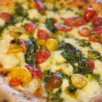 Pizza Pesto · mozzarella cheese, heirloom cherry tomatoes, basil, parmesan cheese, basil pesto