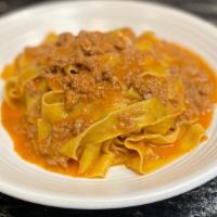 Tagliatelle Bolognese · homemade tagliatelle pasta, ragú of llano seco pork and bassian farm beef.