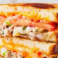Tuna Melt · Grilled albacore tuna, tomatoes, melted cheddar on sourdough.
