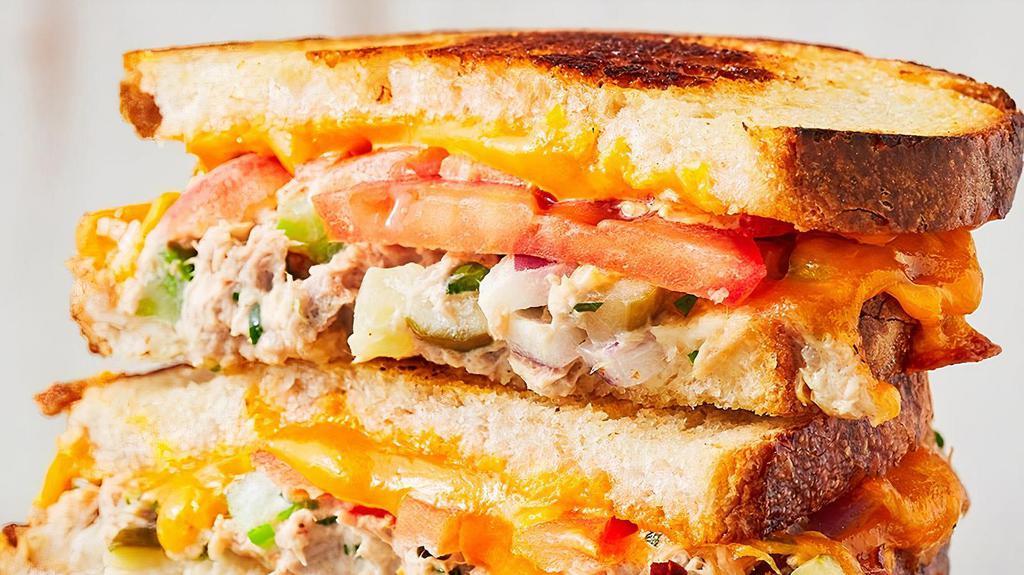 Tuna Melt · Grilled albacore tuna, tomatoes, melted cheddar on sourdough.