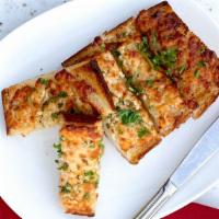 Cheesy Garlic Bread with Crab · all the cheesy goodness with loose crab meat on top