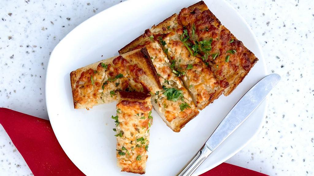 Cheesy Garlic Bread with Crab · all the cheesy goodness with loose crab meat on top