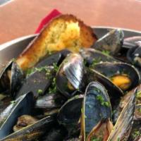Steamed West Coast Black Mussels · 14 oz steamed with white wine, butter, fresh garlic; served with garlic bread.